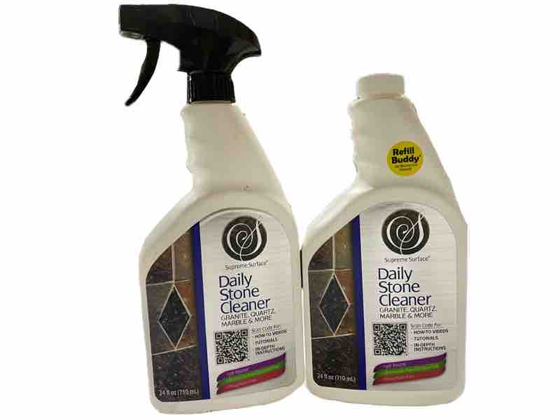 An official image of Supreme Surface® Daily Stone Cleaners for Granite Quartz Marble & More, 24 fl oz Spray, and a 24 fl oz Refill Buddy.