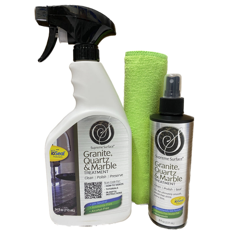 supreme surface granite quartz and marble treatment 24 fl oz spray bottle, green microfiber towel, and an 8 fl oz spray showen side-by-side as a value pack.